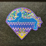 Colorful embroidered patch featuring a blue cat silhouette on a purple diamond-patterned background with floral accents.