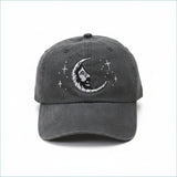 Dark gray denim baseball cap featuring a white embroidered crescent moon with a face and stars.