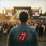 Blue denim jacket featuring a prominent red embroidered rolling stones tongue and lips patch on the back.