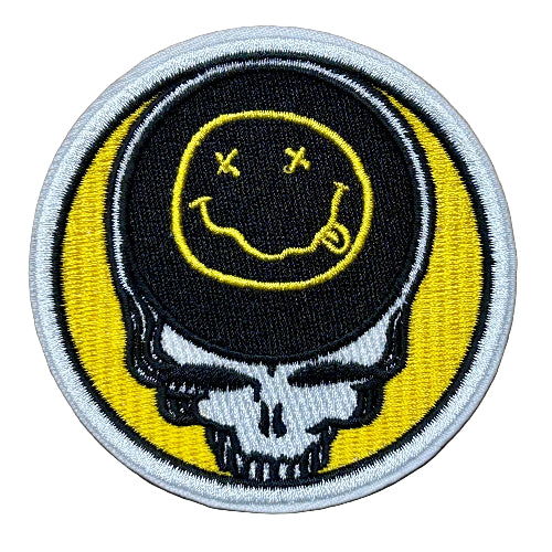 Embroidered patch with a smiley face and skull design on a brown background